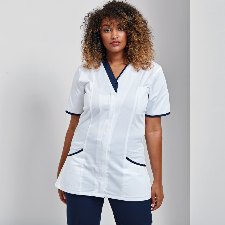 Nurse is showing off her white with blue trim uniform 